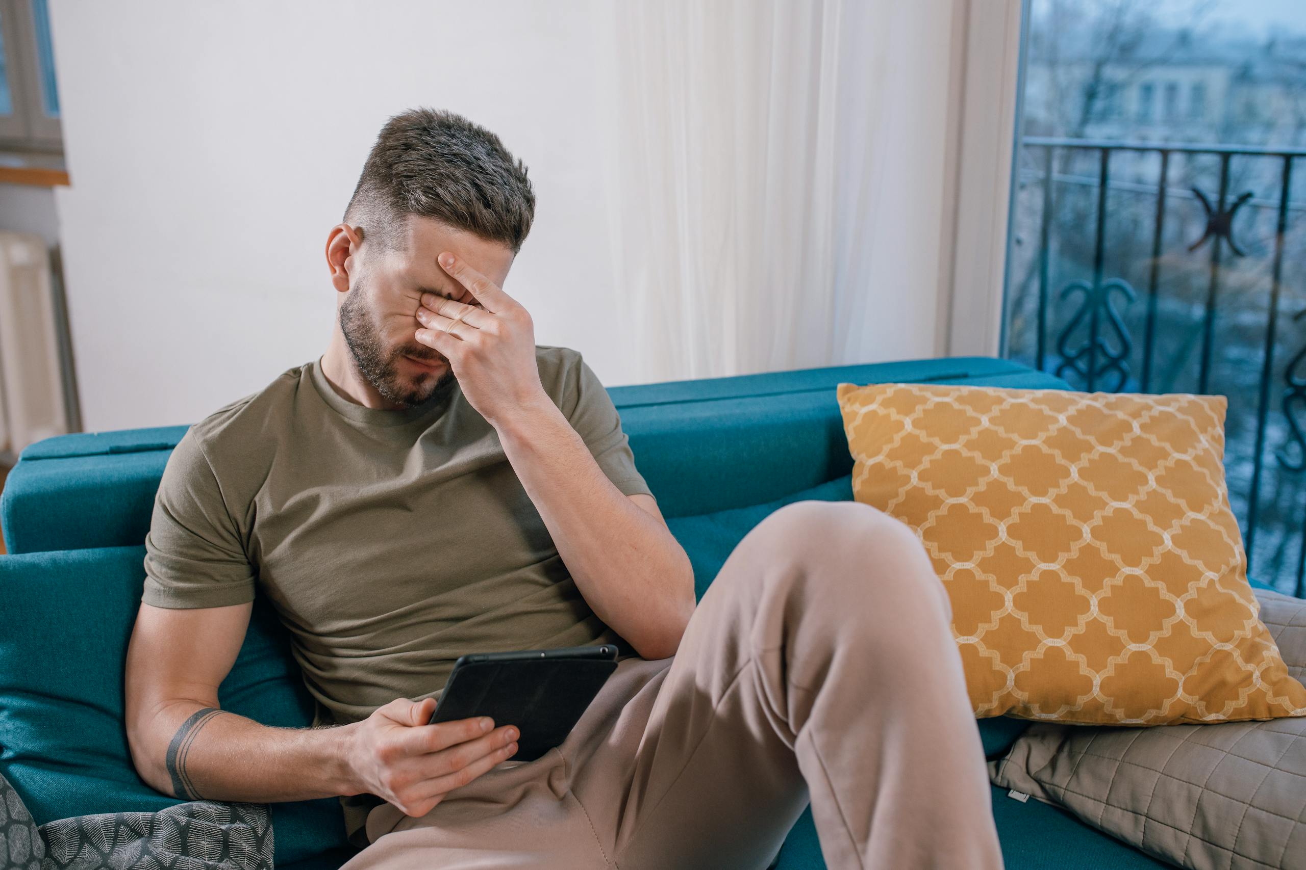 A Man with a Black Tablet Crying